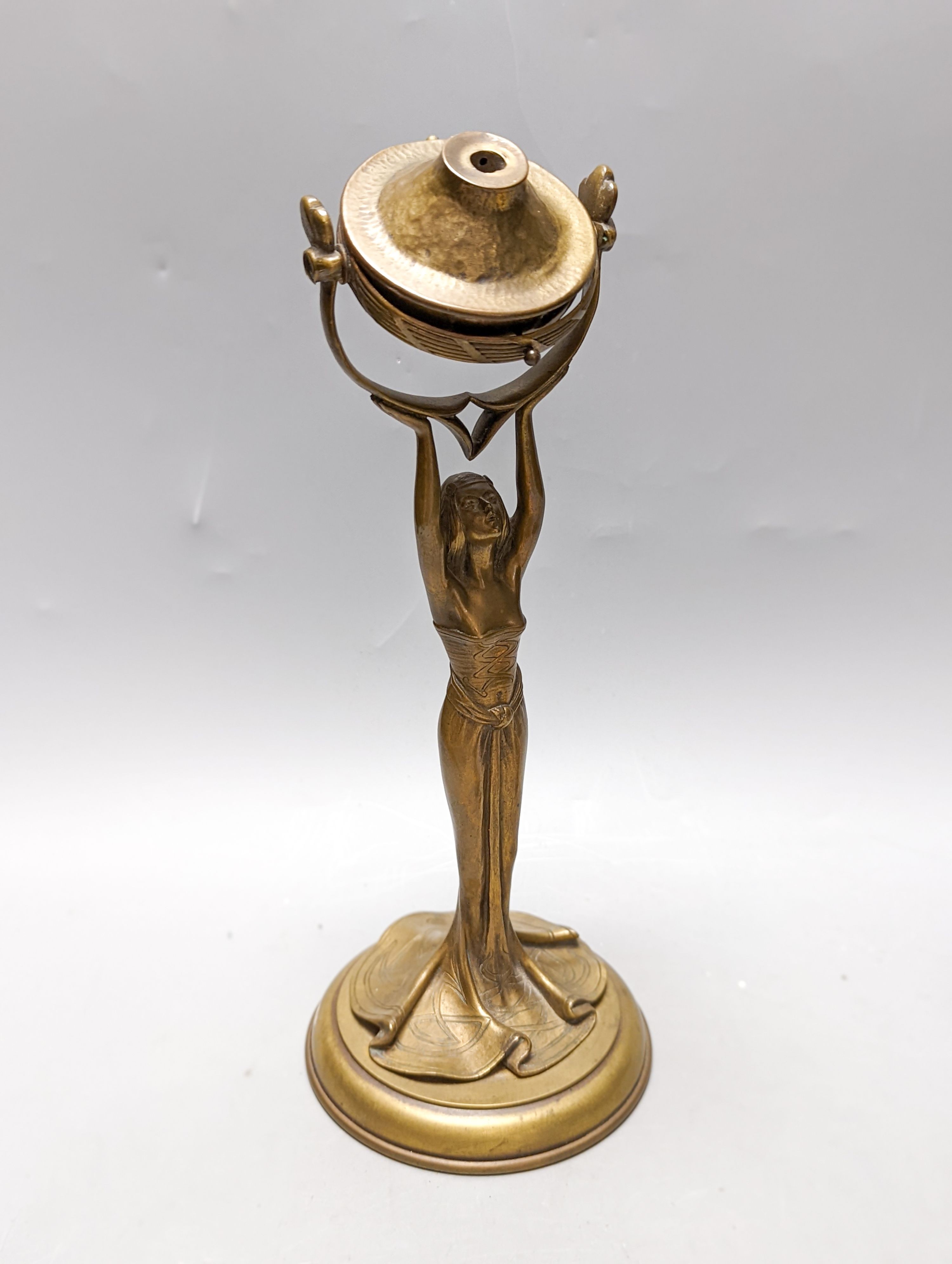 An Arts and Crafts brass/copper group - figural gimbal lamp, mantle timepiece, lidded box etc.